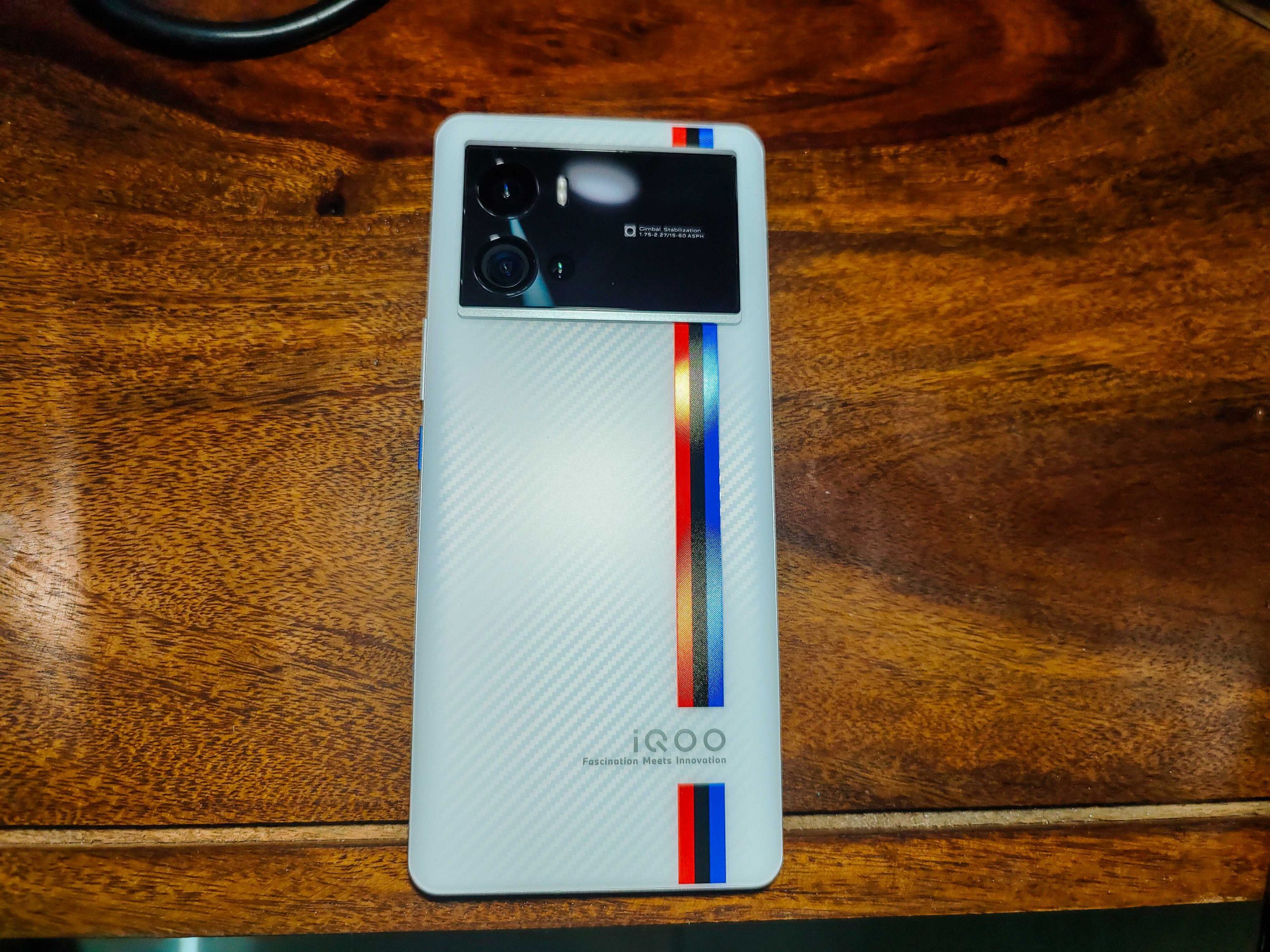  A photo of the iQOO 13 smartphone, which has a flat QHD resolution screen.